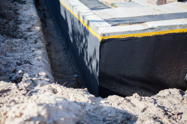 Professional Waterproofing technician working in Devon, PA
